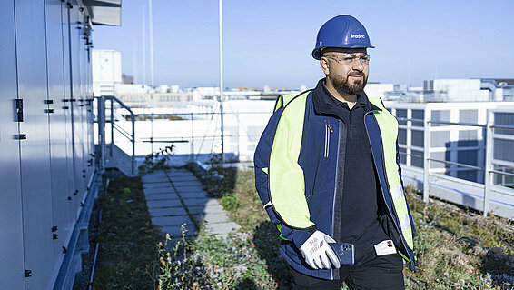 Leadec employee walking on a factory roof for inspection.